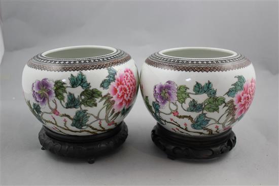 A pair of Chinese famille rose globular bowls, Qianlong marks, Republic period, 16.5cm diam, stands